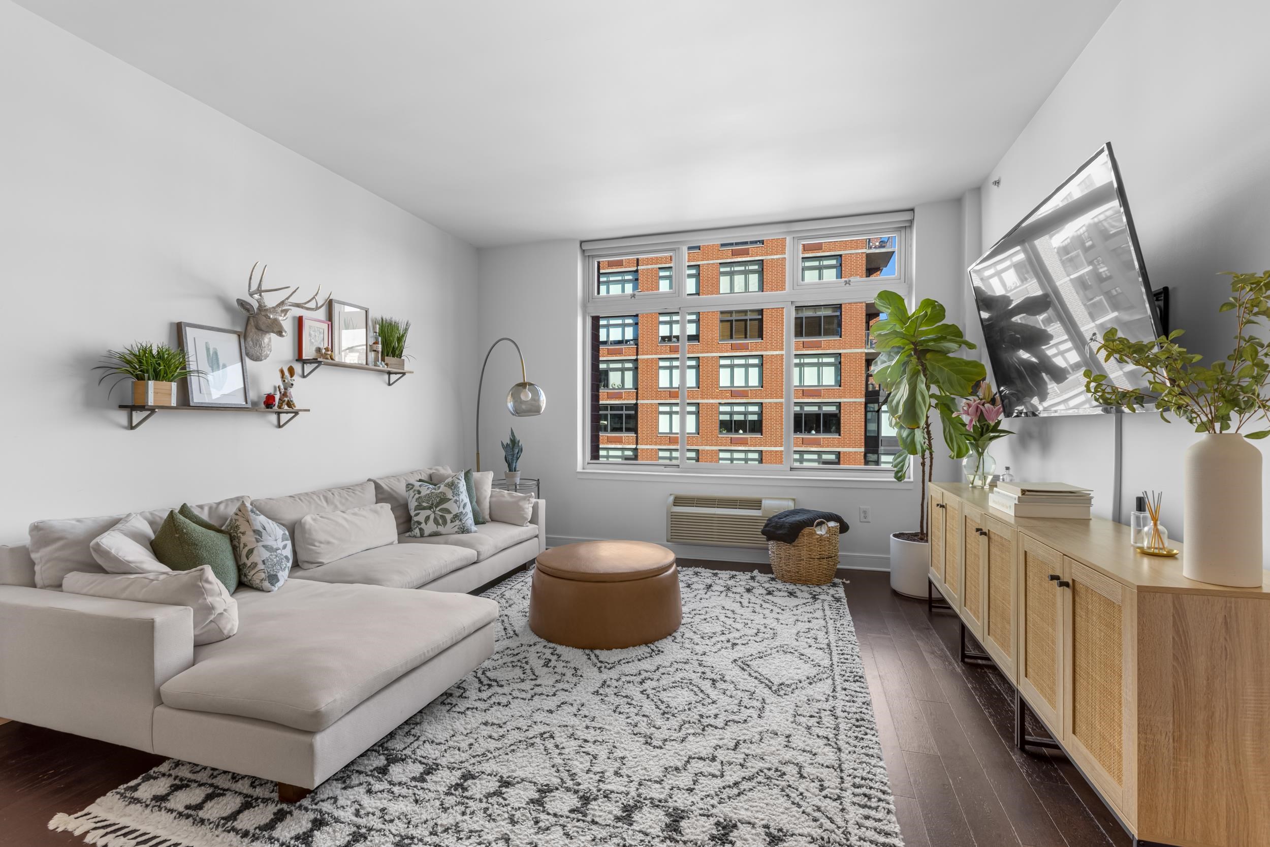 1450 Washington Street, Unit 608 Hoboken, NJ 07030 - Photo 17 of 44 a living room with furniture and a potted plant