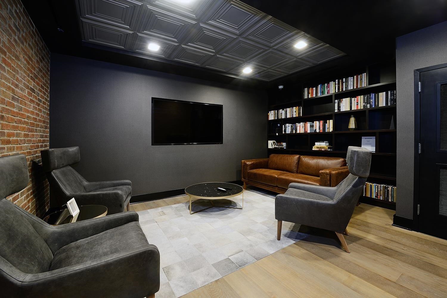 1450 Washington Street, Unit 608 Hoboken, NJ 07030 - Photo 28 of 44 a living room with furniture and a flat screen tv