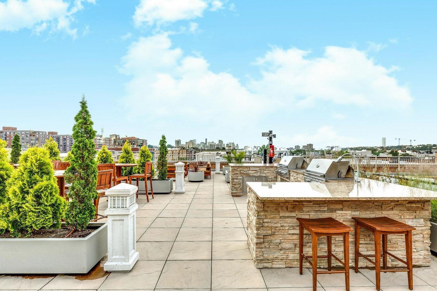 1450 Washington Street, Unit 608 Hoboken, NJ 07030 - Photo 37 of 44 a view of swimming pool with outdoor seating and plants