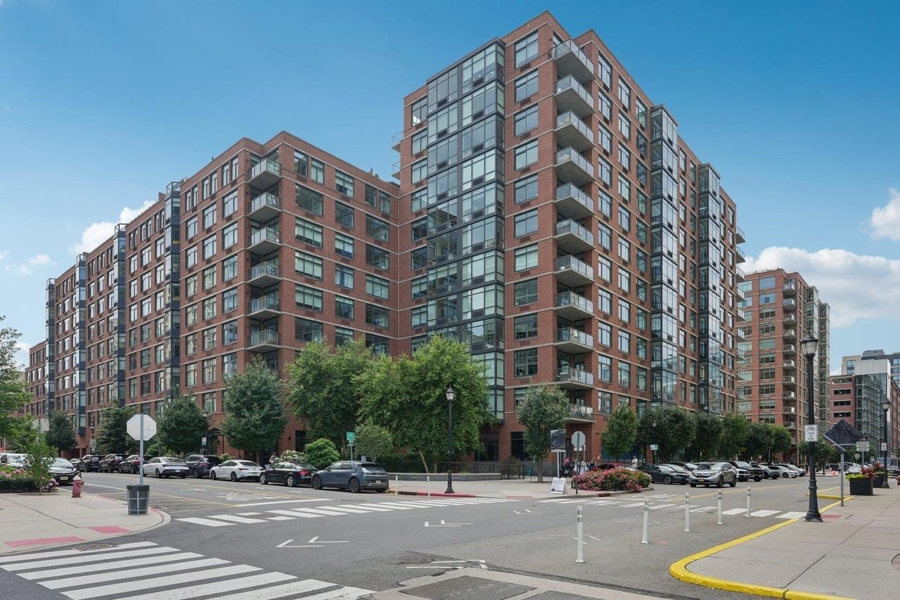 1450 Washington Street, Unit 608 Hoboken, NJ 07030 - Photo 42 of 44 a view of a tall building next to a road