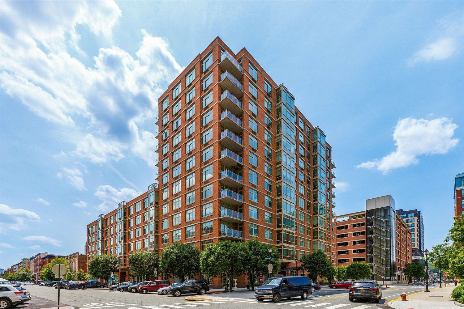 1450 Washington Street, Unit 608 Hoboken, NJ 07030 - Photo 43 of 44 a city street lined with buildings and cars parked on the roadside