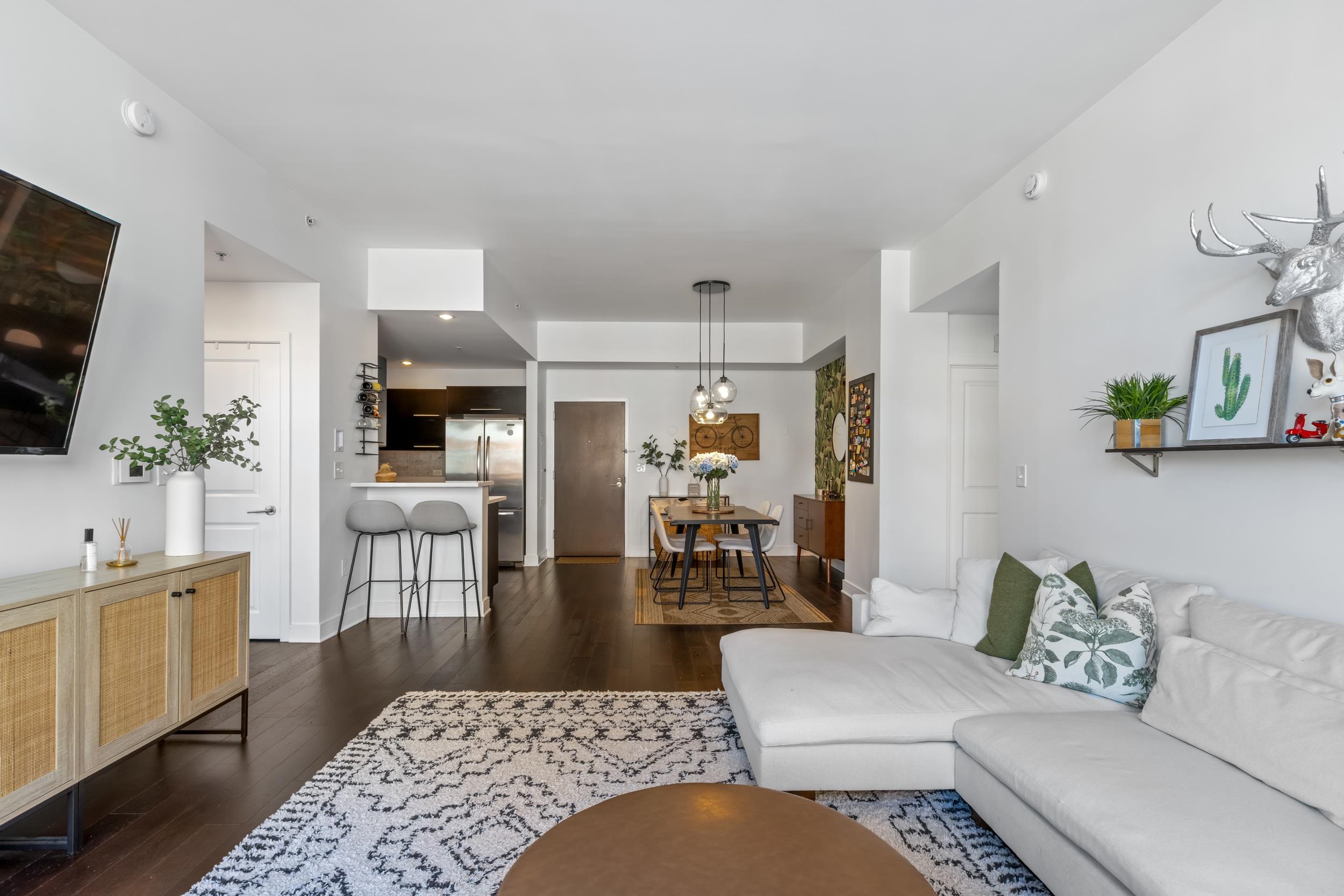 1450 Washington Street, Unit 608 Hoboken, NJ 07030 - Photo 7 of 44 a living room with furniture wooden floor and a flat screen tv