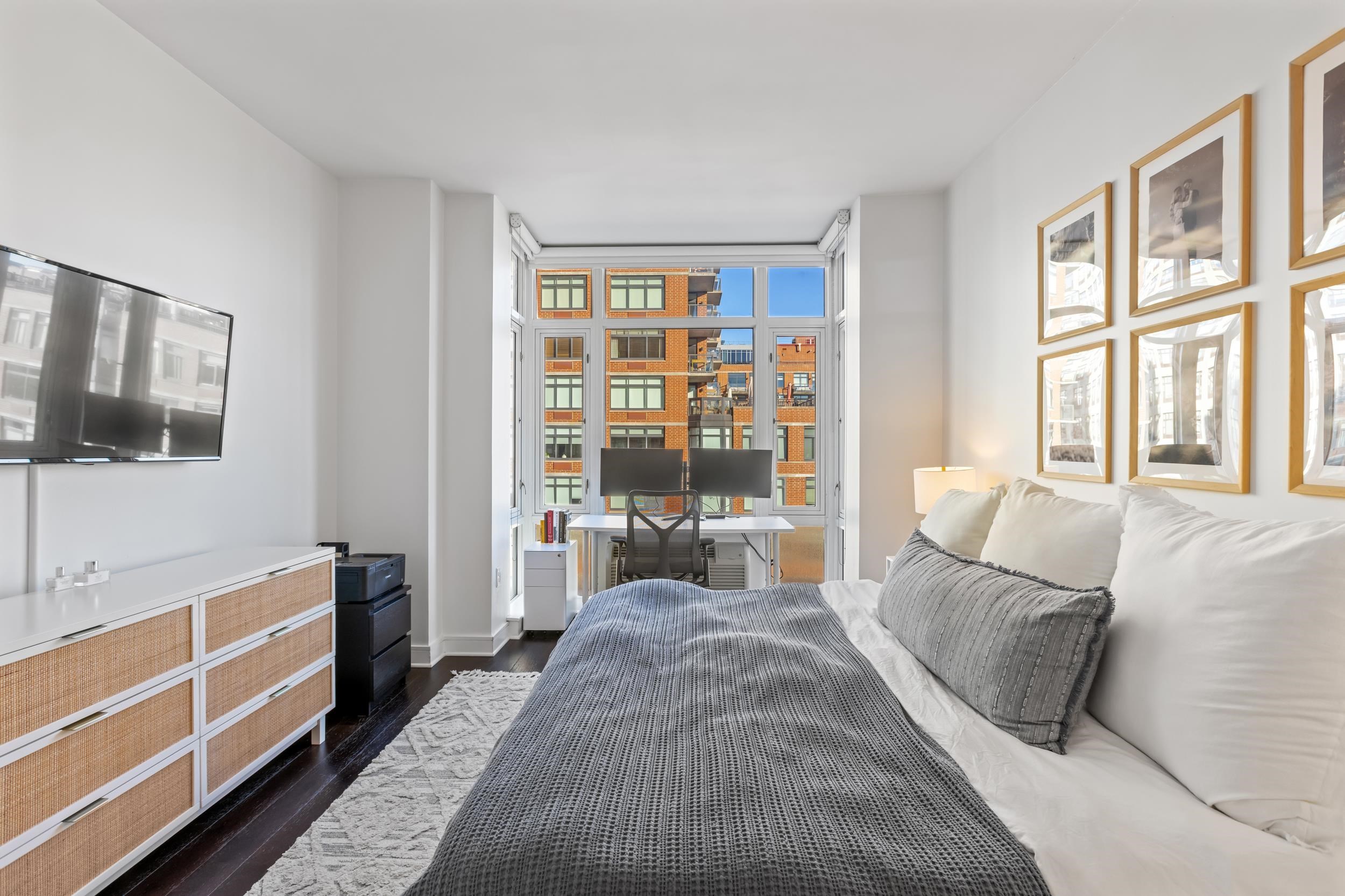 1450 Washington Street, Unit 608 Hoboken, NJ 07030 - Photo 9 of 44 a living room with furniture and a window