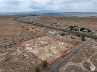 68 King Street Thompson, UT 84540 - Photo 17 of 23 Overview of rural landscape featuring property parcel outlined and a mountainous background