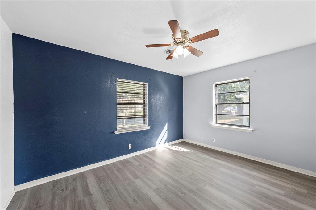 901 North Main Street West, TX 76691 - Photo 21 of 32 a view of a big room with wooden floor and windows