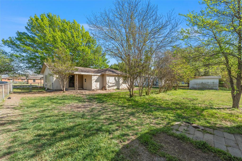 901 North Main Street West, TX 76691 - Photo 30 of 32 a front view of a house with a garden