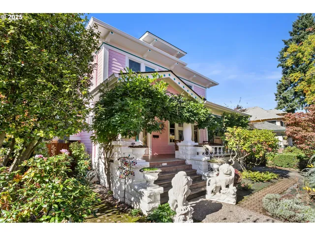 a front view of a house with a garden