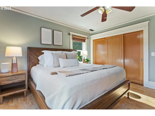 a bedroom with a bed and a night stand