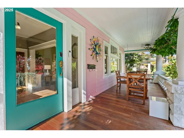 a living room filled with furniture and a potted plant