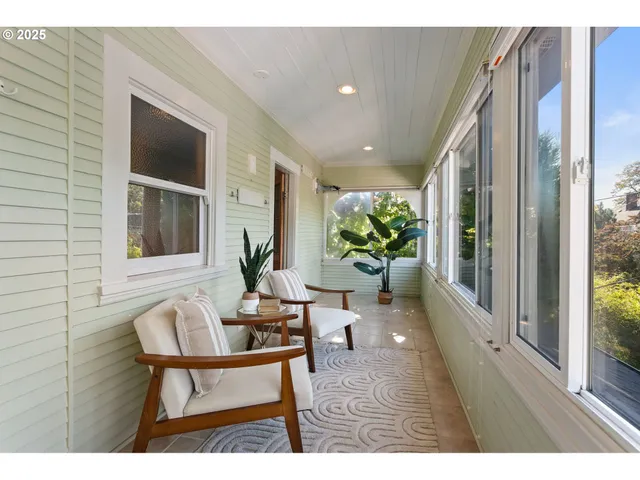 a outdoor living space with furniture and a potted plant