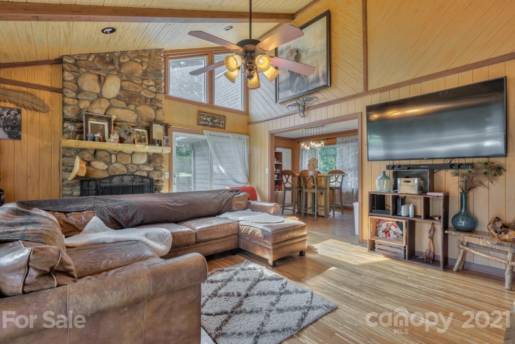 125 Mountainview Road Landrum, SC 29356 - Photo 12 of 48 a living room with furniture and chandelier