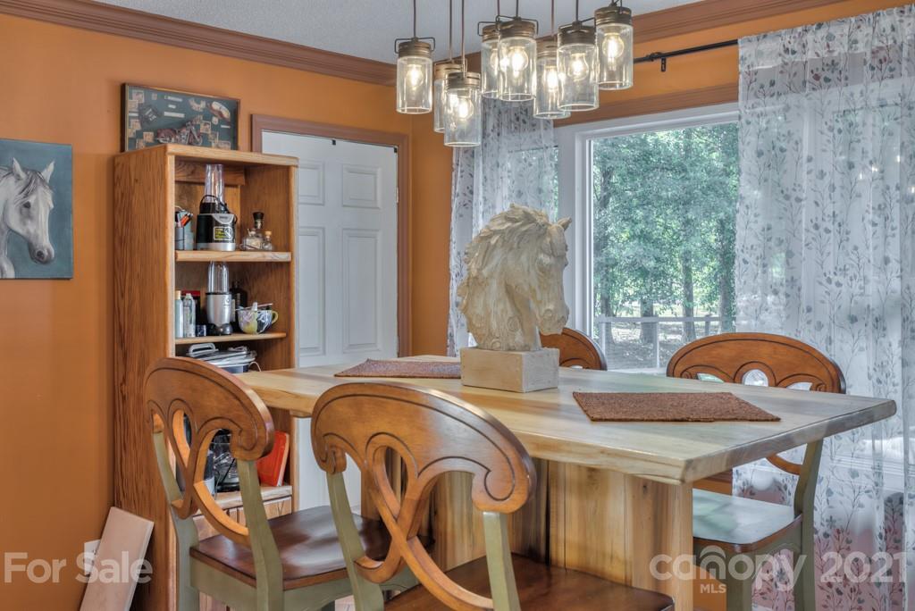 125 Mountainview Road Landrum, SC 29356 - Photo 14 of 48 a view of a dining room with furniture window and outside view