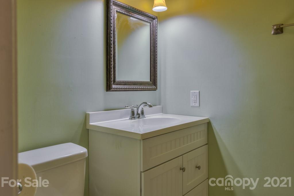 125 Mountainview Road Landrum, SC 29356 - Photo 25 of 48 a bathroom with a sink and a toilet
