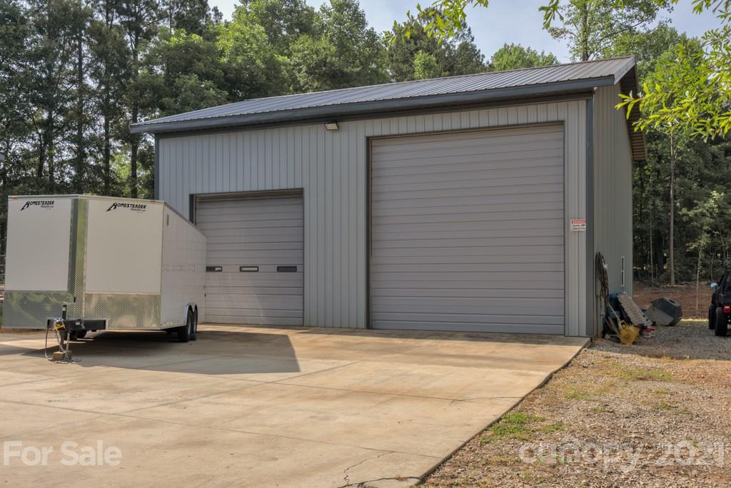 125 Mountainview Road Landrum, SC 29356 - Photo 27 of 48 a view of a house with a garage