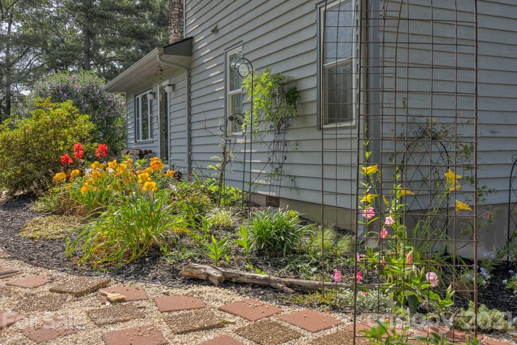 125 Mountainview Road Landrum, SC 29356 - Photo 33 of 48 a view of a backyard with flowers