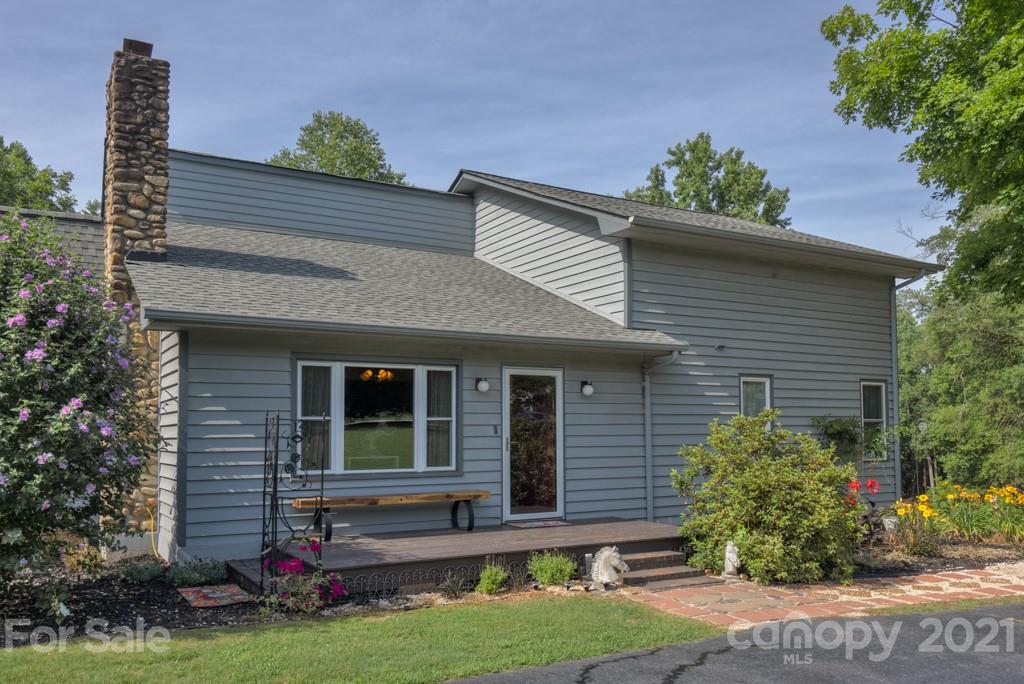 125 Mountainview Road Landrum, SC 29356 - Photo 35 of 48 a front view of a house with a yard