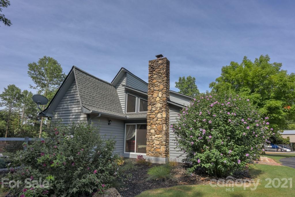 125 Mountainview Road Landrum, SC 29356 - Photo 38 of 48 a front view of a house with a garden