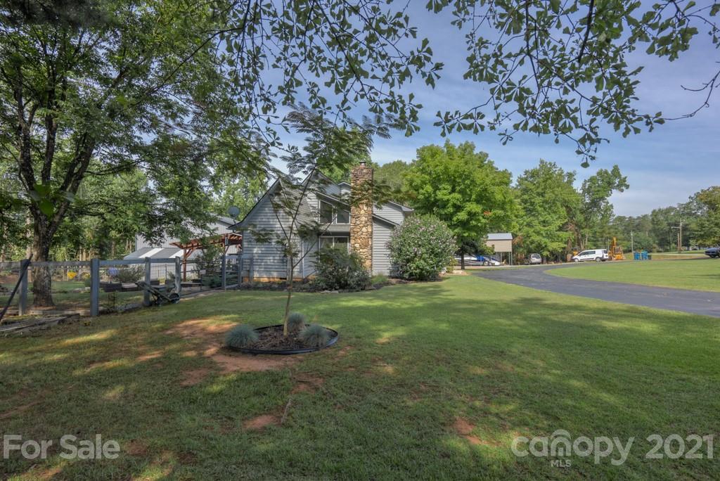 125 Mountainview Road Landrum, SC 29356 - Photo 39 of 48 a view of backyard with huge green field and trees