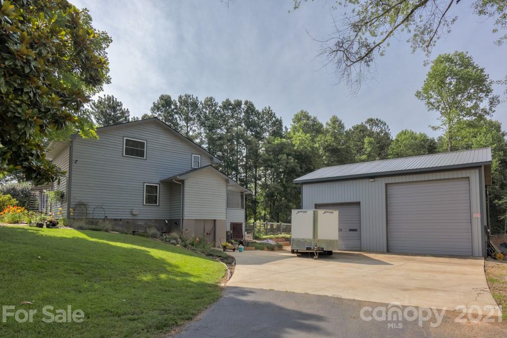 125 Mountainview Road Landrum, SC 29356 - Photo 5 of 48 a view of a house with a yard and large tree