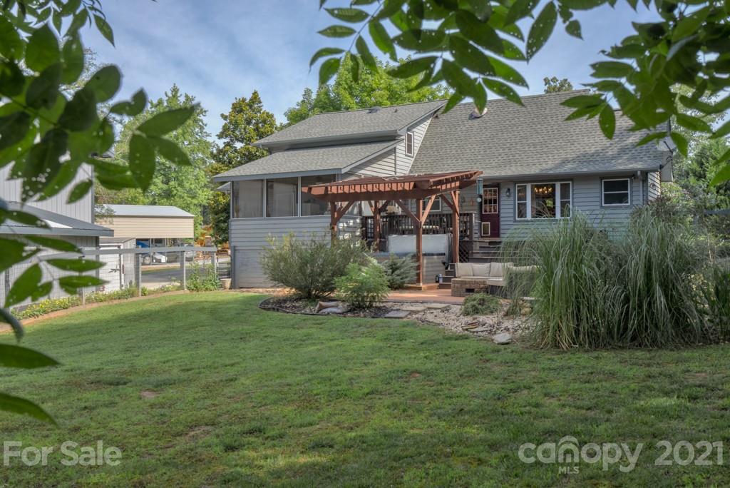 125 Mountainview Road Landrum, SC 29356 - Photo 41 of 48 a view of a house with a yard and sitting area