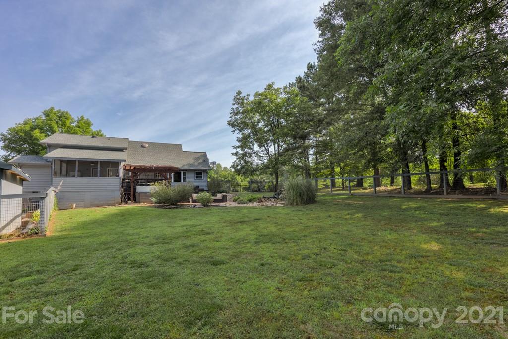 125 Mountainview Road Landrum, SC 29356 - Photo 42 of 48 a front view of house with yard and trees