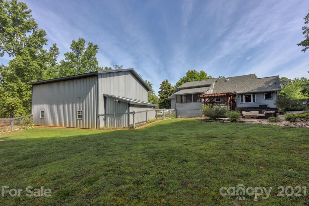 125 Mountainview Road Landrum, SC 29356 - Photo 43 of 48 a view of a house with a yard and sitting area