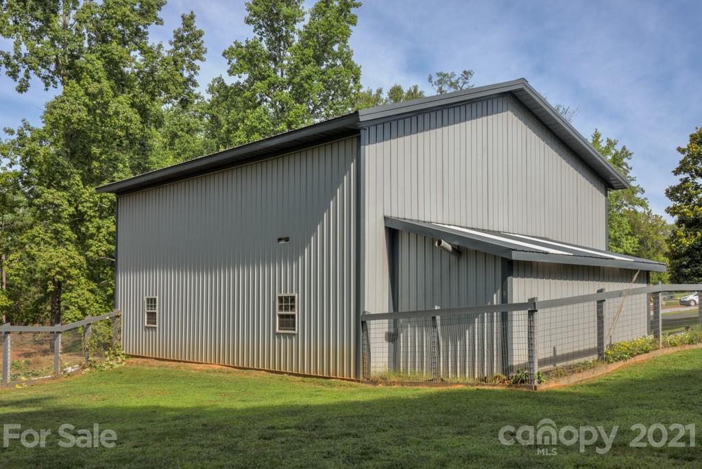 125 Mountainview Road Landrum, SC 29356 - Photo 44 of 48 a backyard of a house with lots of green space