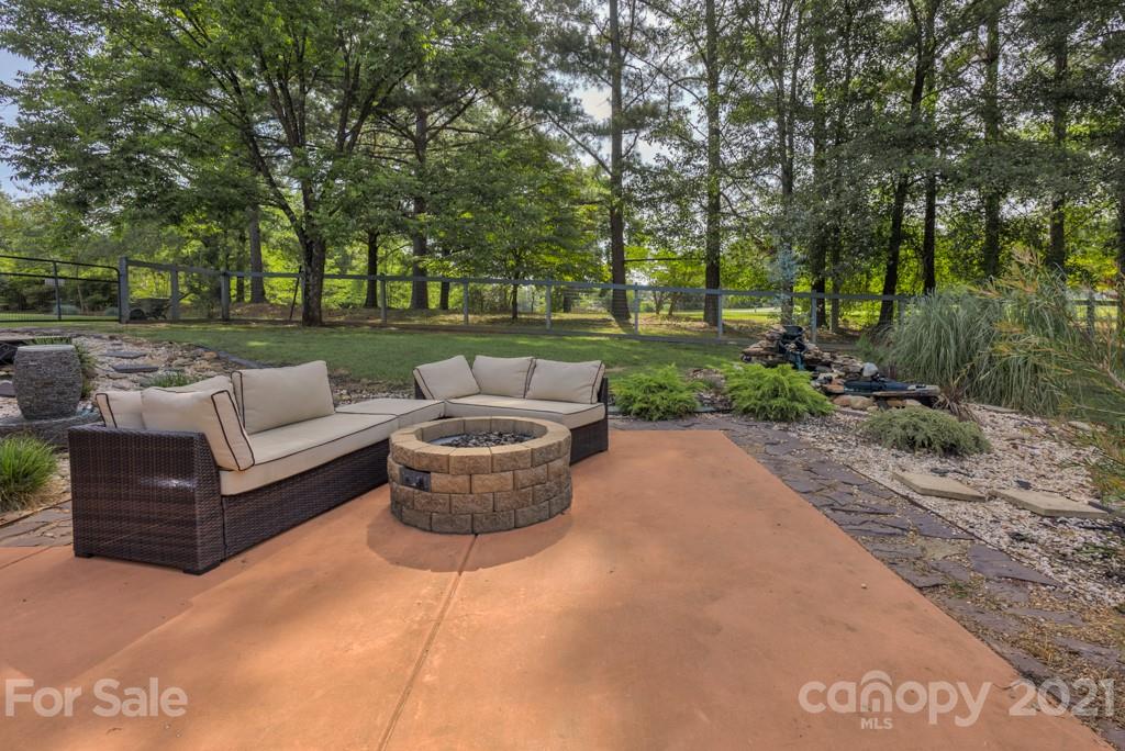 125 Mountainview Road Landrum, SC 29356 - Photo 47 of 48 a view of a patio with couches and a fire pit