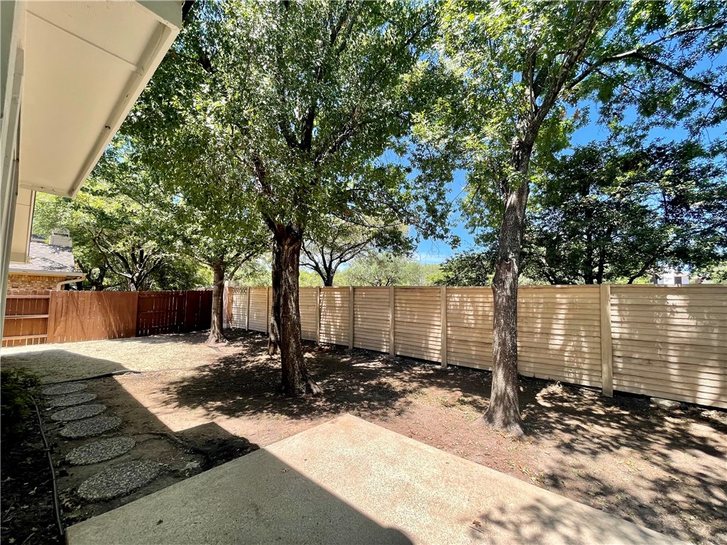 1881 Dapplegrey Lane Austin, TX 78727 - Photo 17 of 28 a view of a back yard of the house