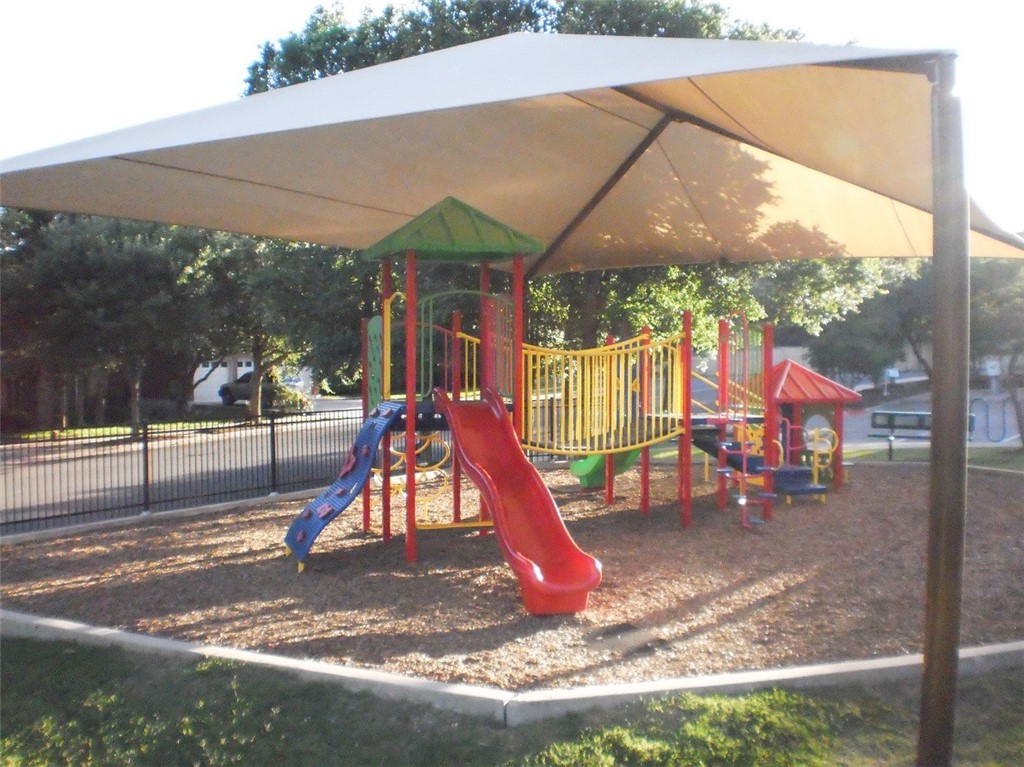1881 Dapplegrey Lane Austin, TX 78727 - Photo 26 of 28 a view of outdoor space with playground and green space