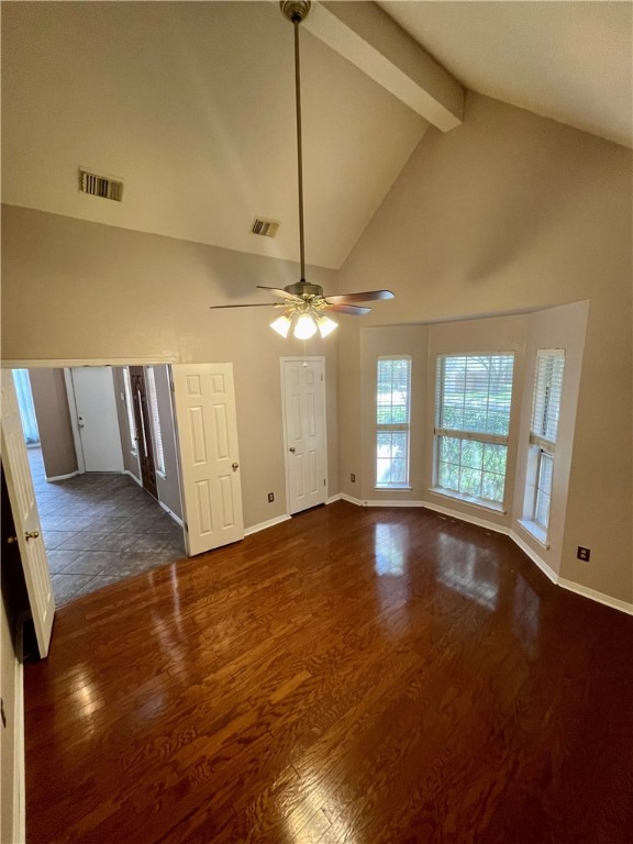1881 Dapplegrey Lane Austin, TX 78727 - Photo 3 of 28 a view of an empty room with window and wooden floor