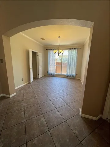 a view of a livingroom with a garage and window