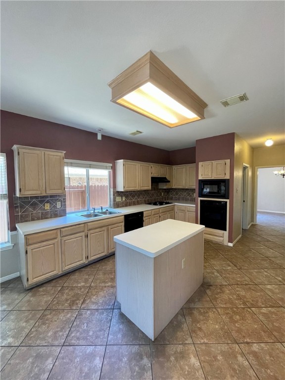 1881 Dapplegrey Lane Austin, TX 78727 - Photo 9 of 28 a large kitchen with kitchen island a stove a sink a oven and a refrigerator