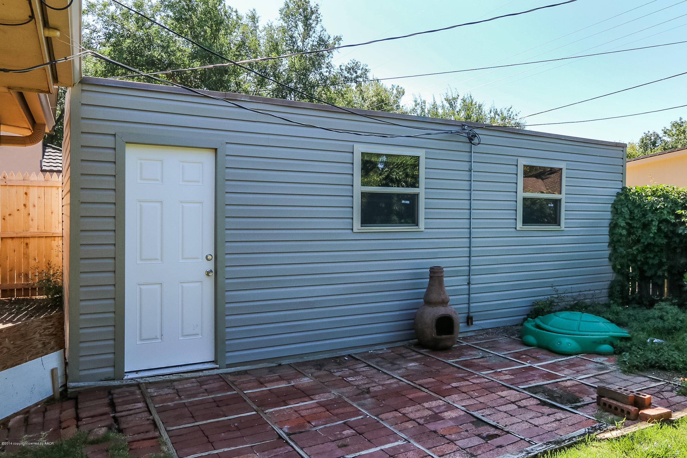 6715 Jameson Road Amarillo, TX 79106 - Photo 22 of 23 a view of a door of a house with a yard