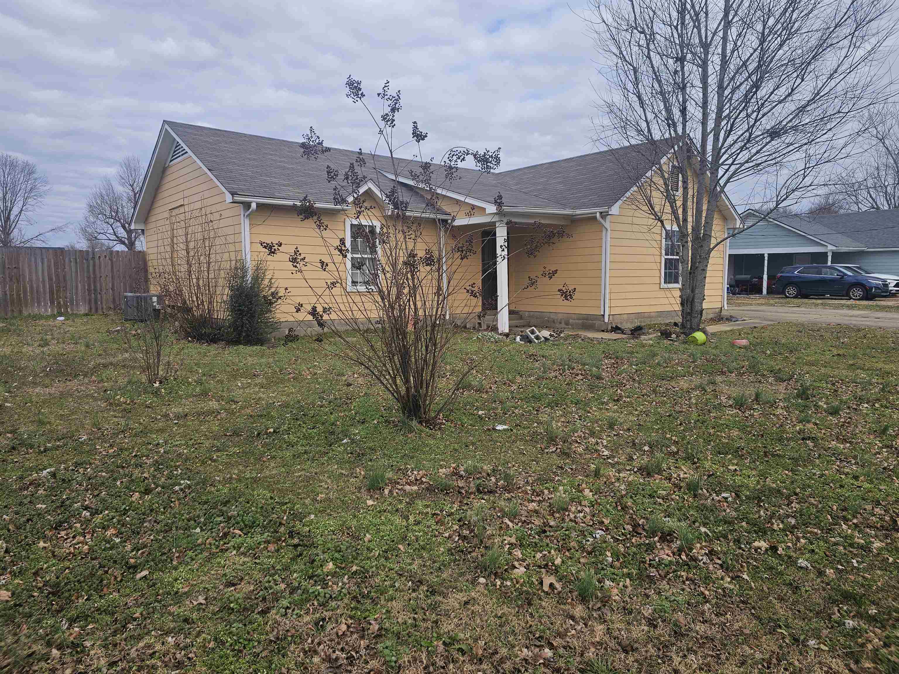605 Jr Drive Covington, TN 38019 - Photo 3 of 21 View of home's exterior with a central AC unit and a shingled roof