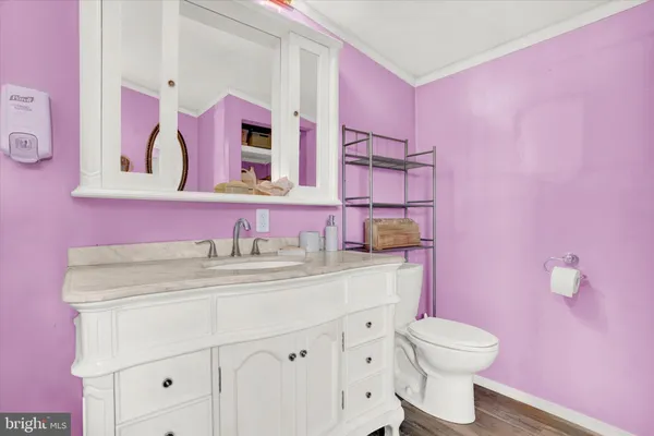 a bathroom with a sink a vanity and a mirror