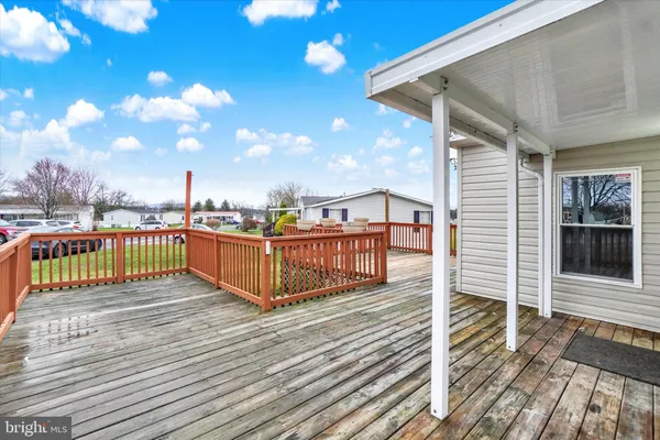 a view of a balcony with wooden floor