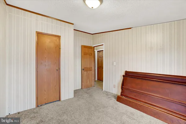 a view of a hallway with closet area