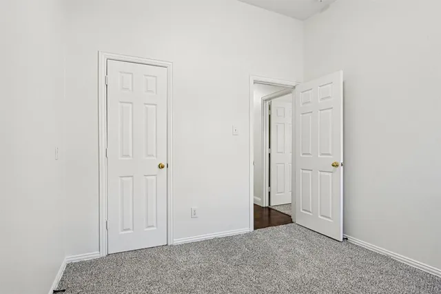 an empty room with closet area