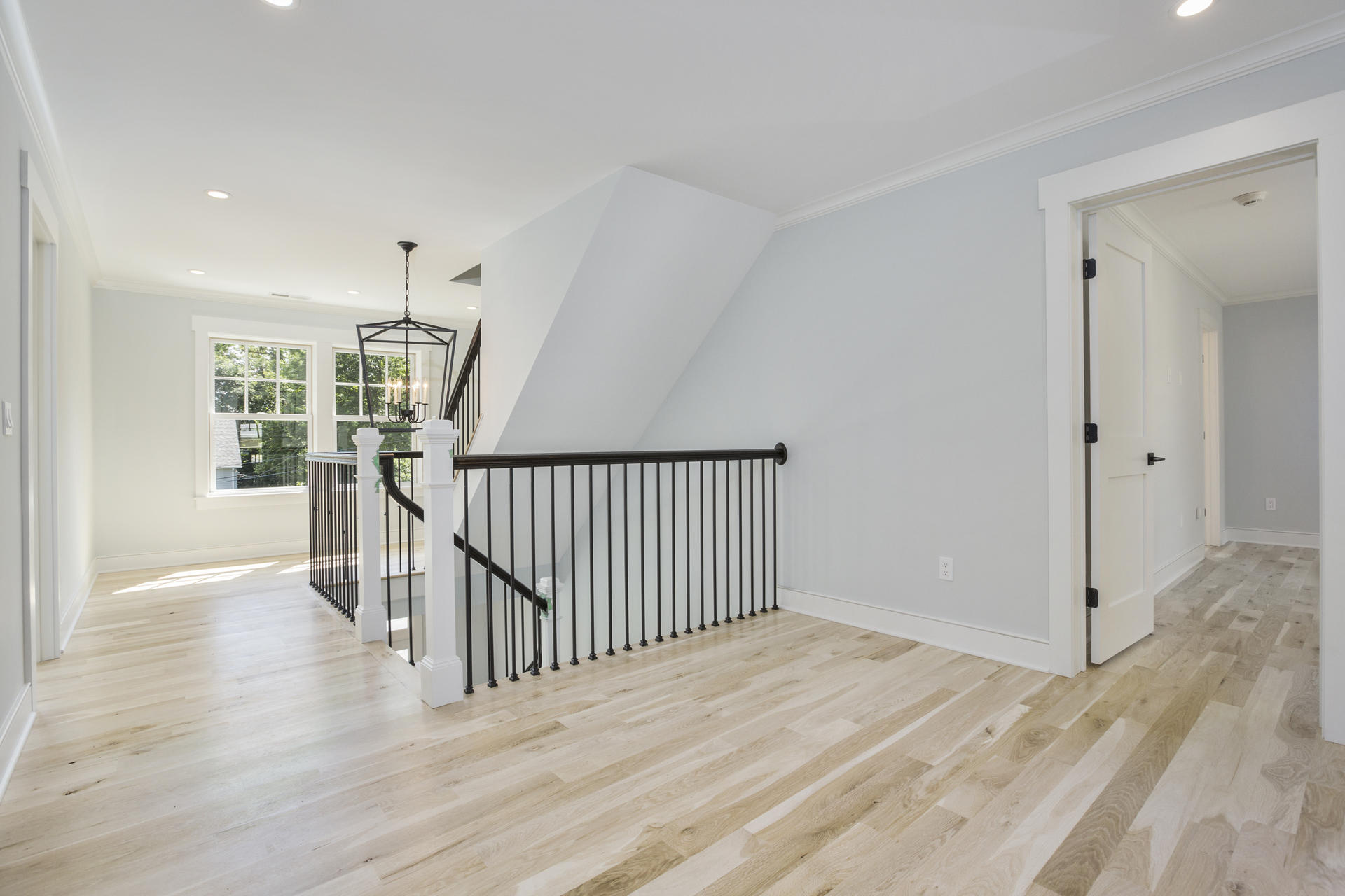 8 Walmsley Road Darien, CT 06820 - Photo 14 of 28 a view of a hallway with wooden floor and stairs
