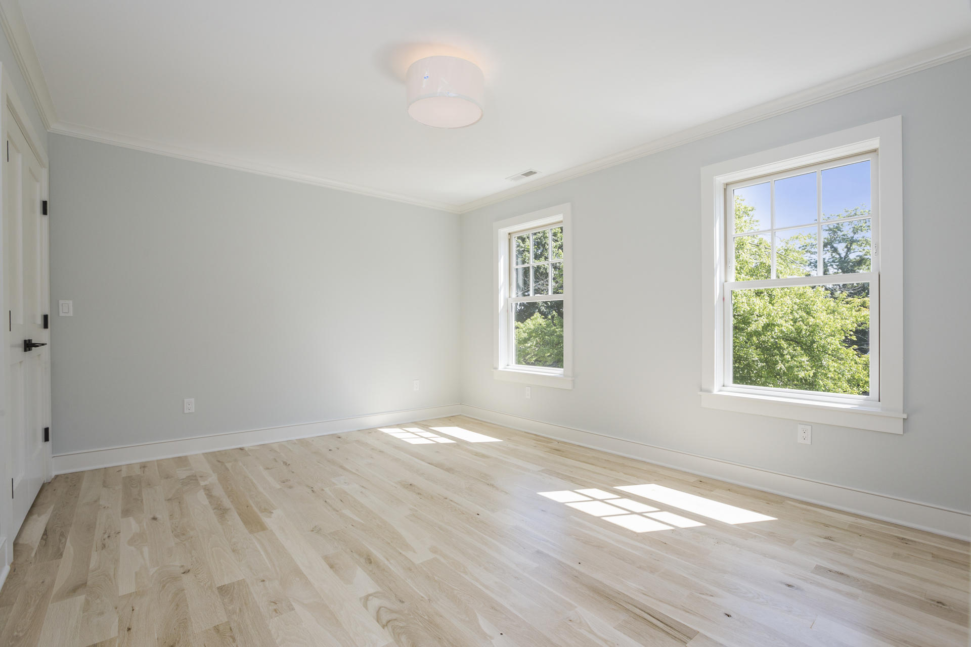 8 Walmsley Road Darien, CT 06820 - Photo 17 of 28 wooden floor in an empty room with a window