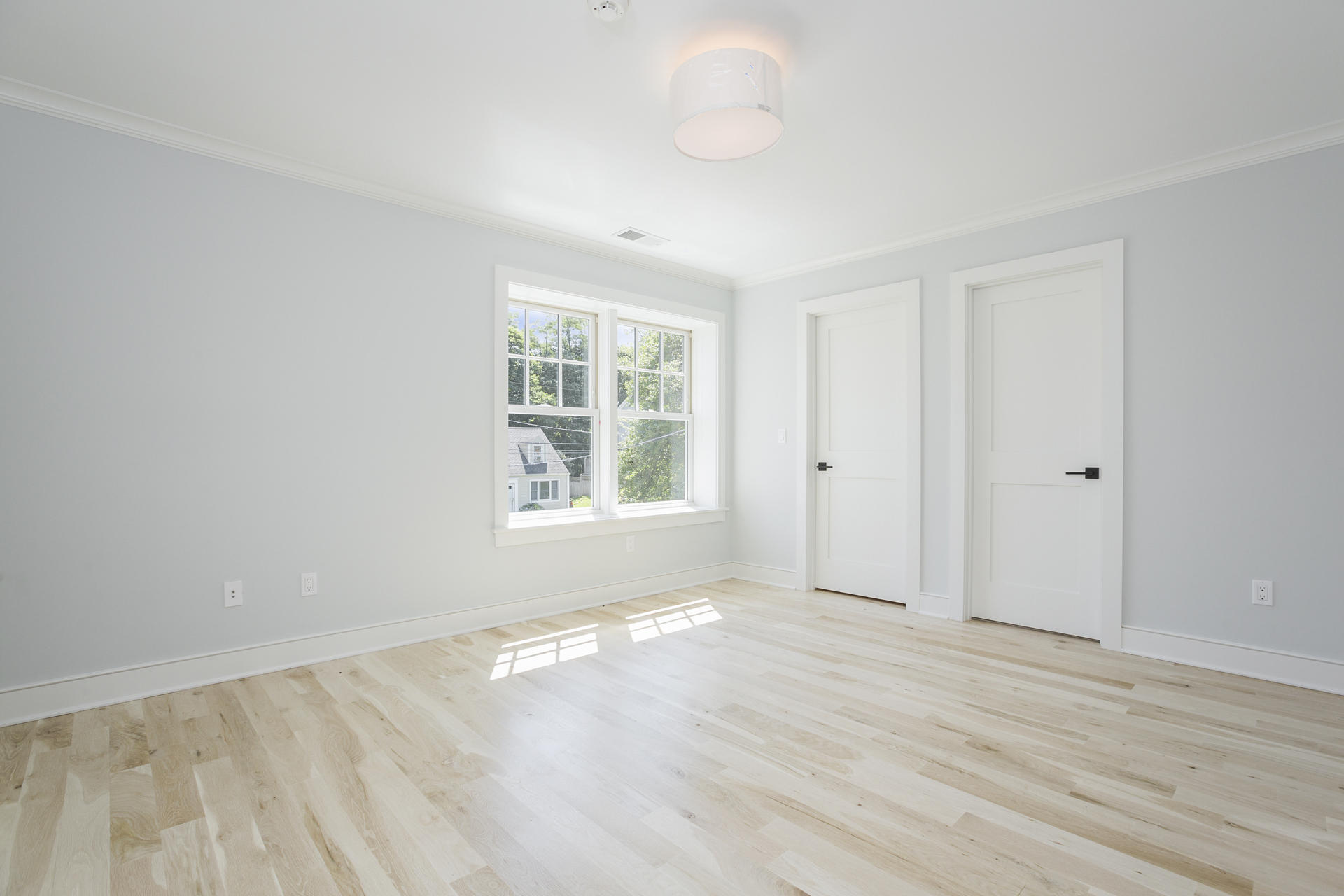 8 Walmsley Road Darien, CT 06820 - Photo 21 of 28 an empty room with wooden floor and windows