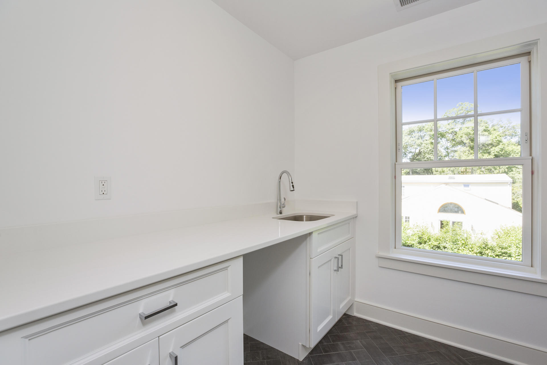 8 Walmsley Road Darien, CT 06820 - Photo 22 of 28 a utility room with a sink dryer and window