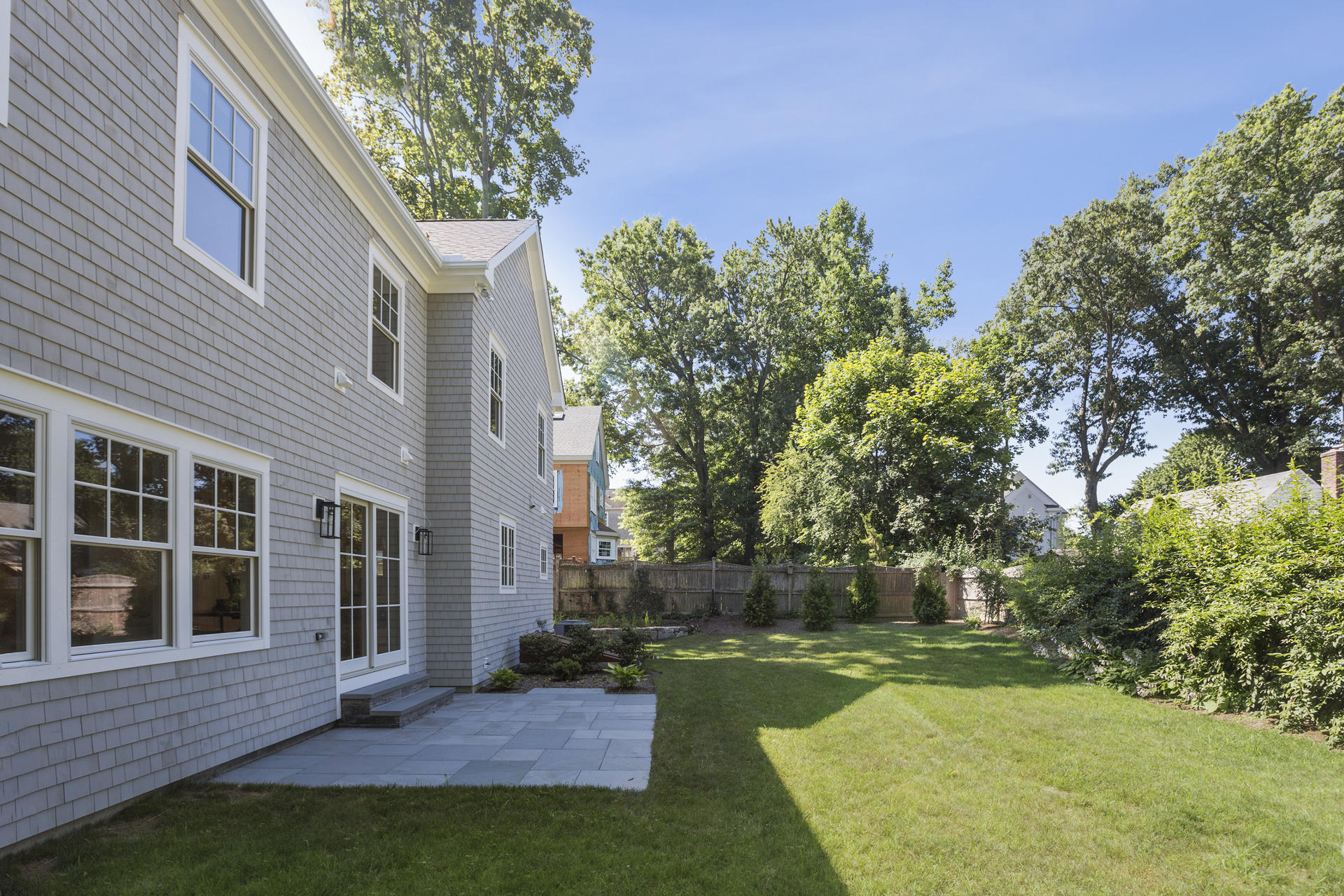 8 Walmsley Road Darien, CT 06820 - Photo 23 of 28 a view of a house with backyard and a tree