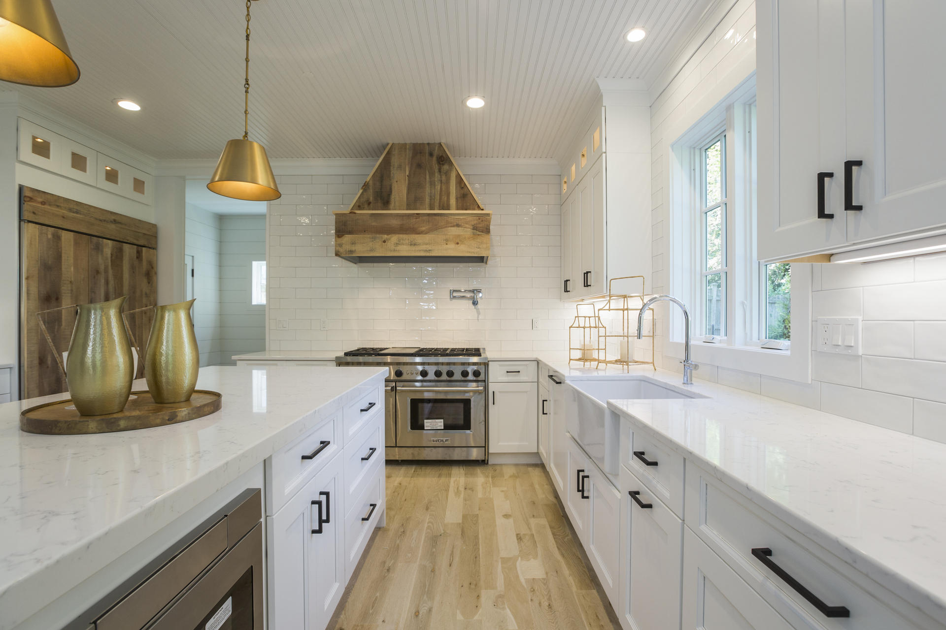 8 Walmsley Road Darien, CT 06820 - Photo 8 of 28 a kitchen with stainless steel appliances granite countertop a sink a stove and a wooden floors