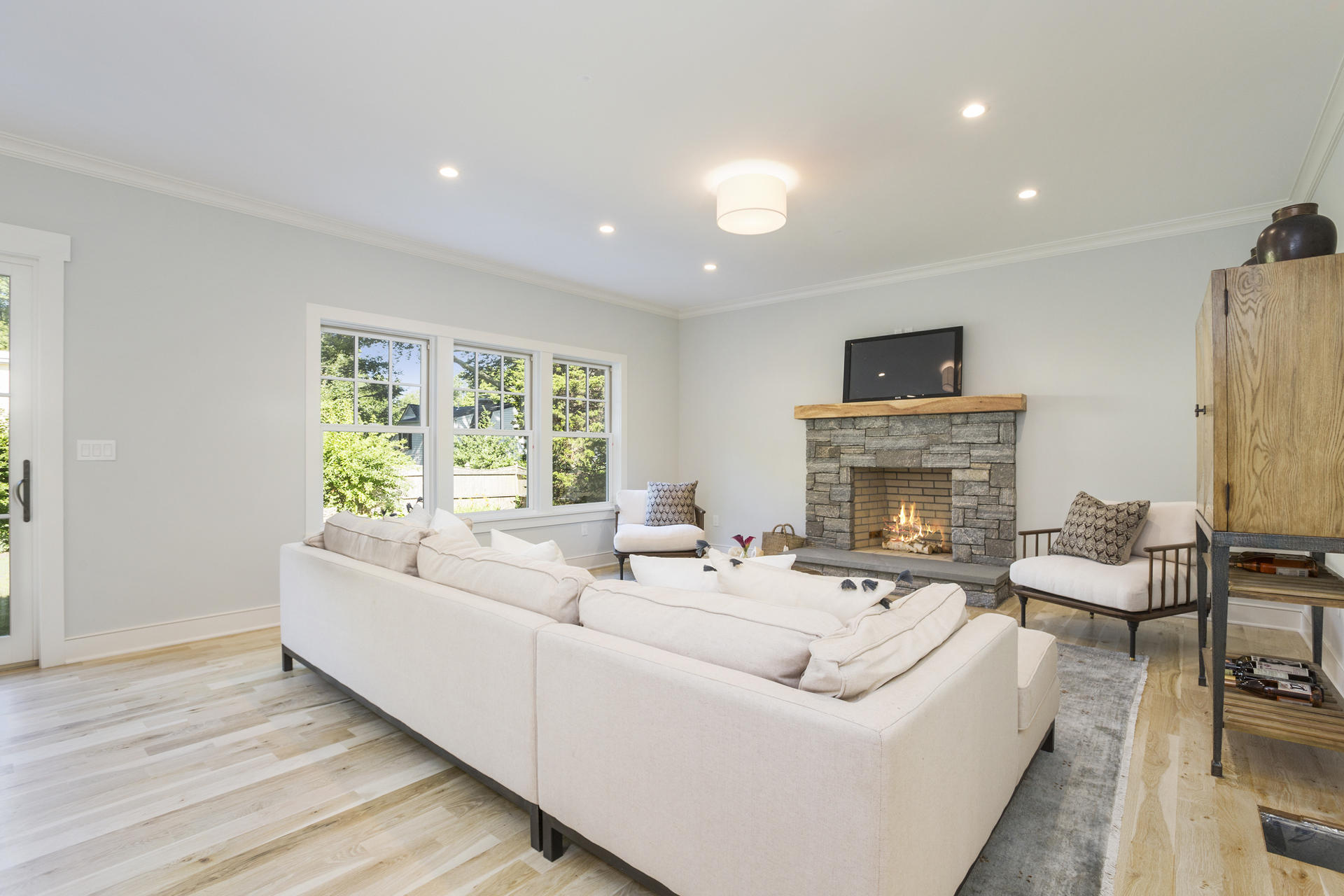 8 Walmsley Road Darien, CT 06820 - Photo 10 of 28 a living room with furniture a fireplace and a flat screen tv