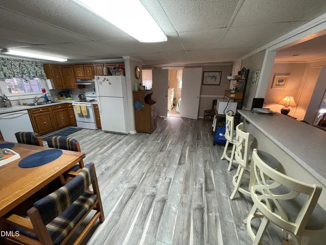 a living room with furniture a window and gym equipment
