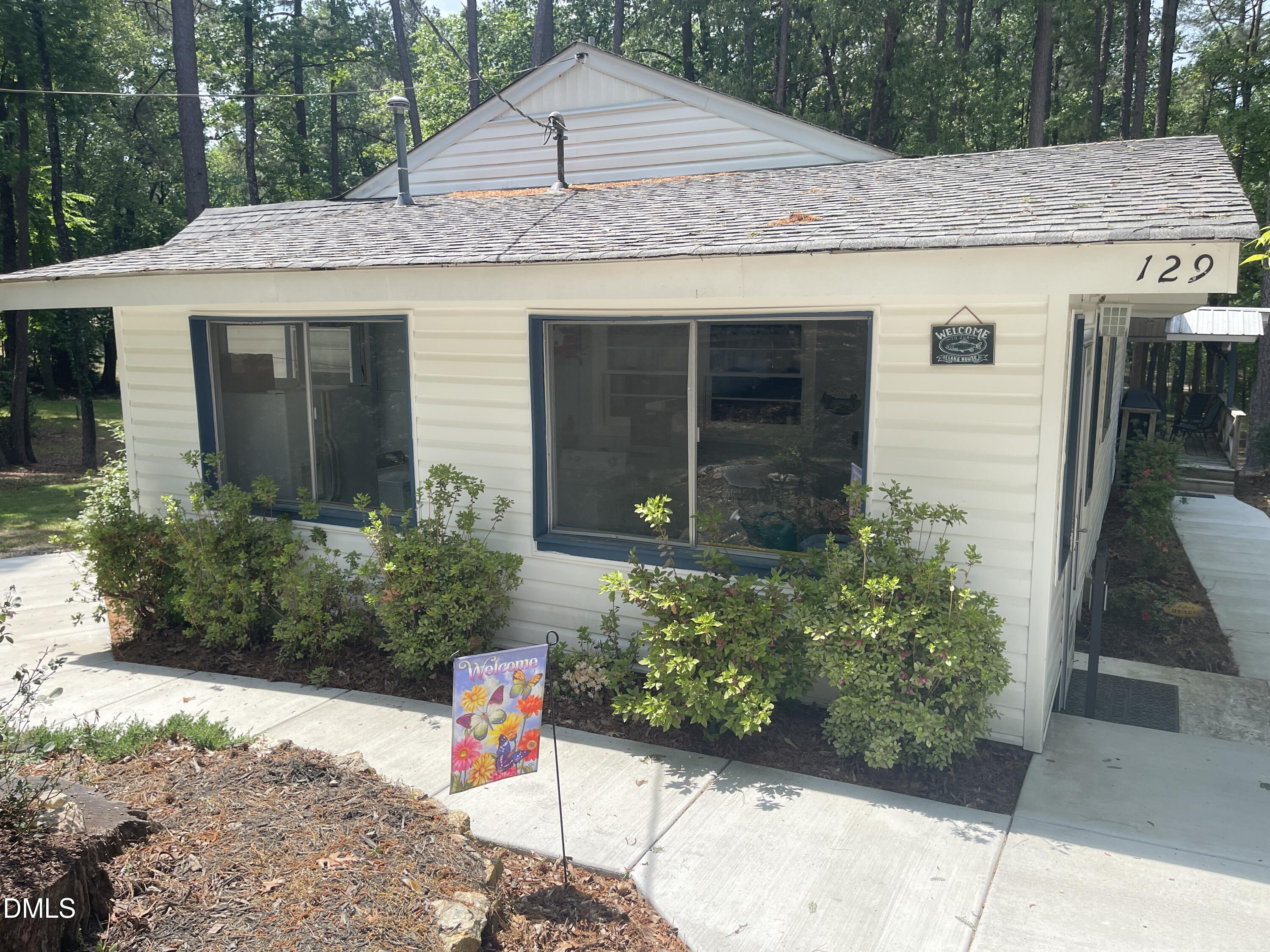 129 Boulder Boulevard Manson, NC 27553 - Photo 2 of 48 a front view of a house with a yard
