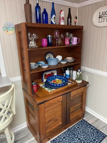 a bathroom with a sink mirror and vanity