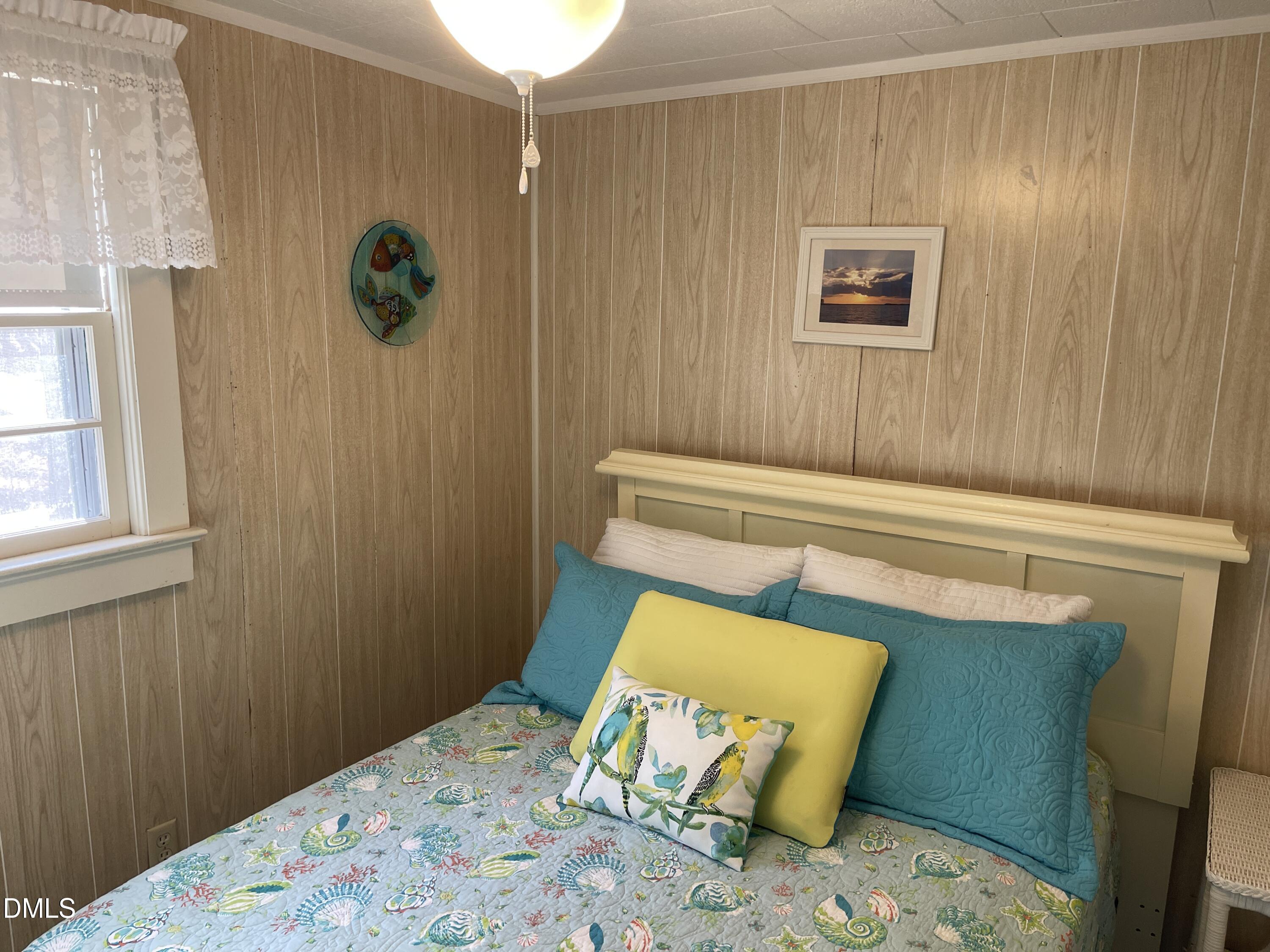 129 Boulder Boulevard Manson, NC 27553 - Photo 25 of 48 a bedroom with a bed and painting on the wall